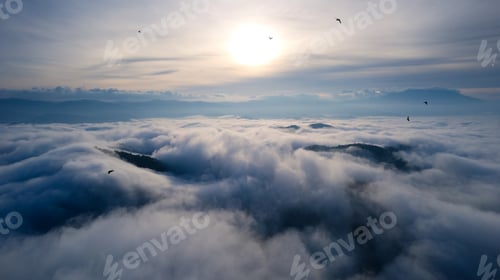 Preview: Sunrise over misty mountain and birds flying in early morning