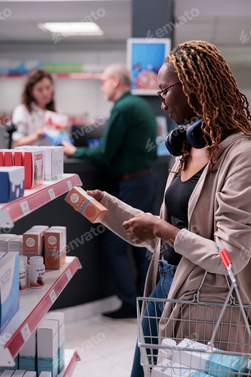 Preview: Customer looking at shelves full with pharmaceutical products