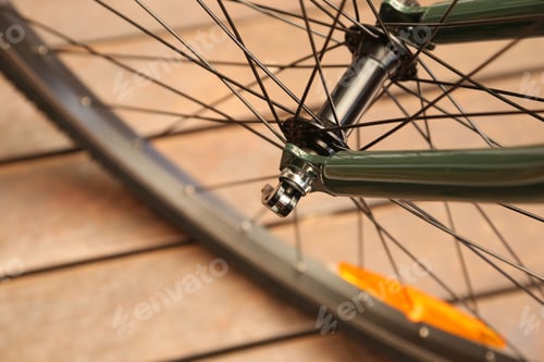 Preview: Closeup shot of a front wheel and spokes of a bicycle