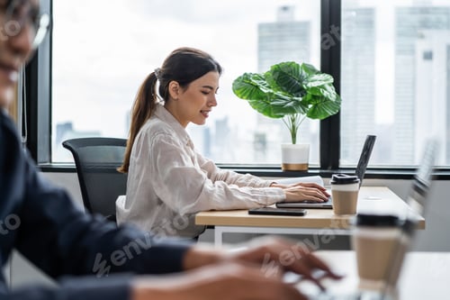 Preview: Asian beautiful businesswoman using laptop computer working in office.