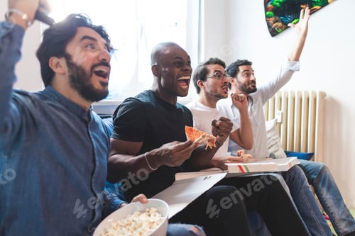 Preview: Friends enjoying a game and pizza together