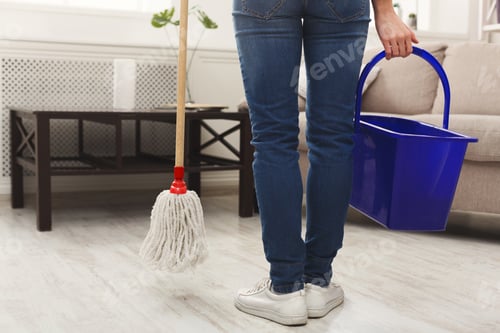Preview: Unrecognizable woman with mop ready to clean floor