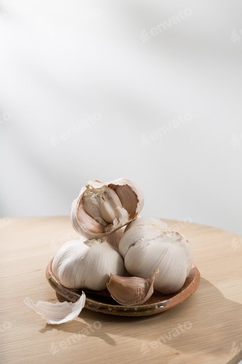 Preview: Garlic Bulbs Piled on a Rustic Plate