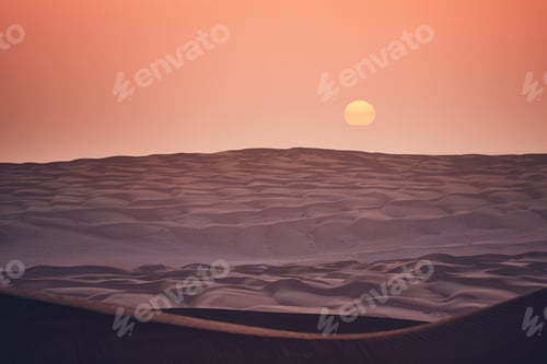 Preview: Sand dunes in desert landscape at sunrise. Wahiba Sands, Sultanate of Oman.