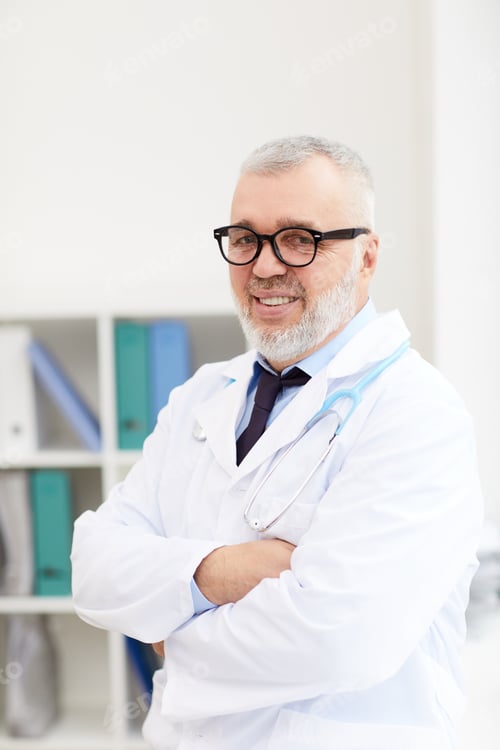 Preview: Successful senior doctor at office