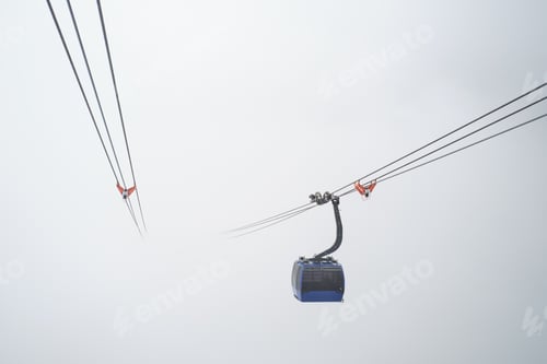 Preview: Gondola cable car cabin surrounded by heavy fog. Road to nowhere. Minimalist landscape.
