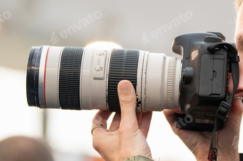 Preview: Close-Up of Photographer and Photo Camera at Trade Show