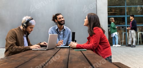 Preview: Young influencers create content on outdoors terrace. Millennial content creators recording podcast.