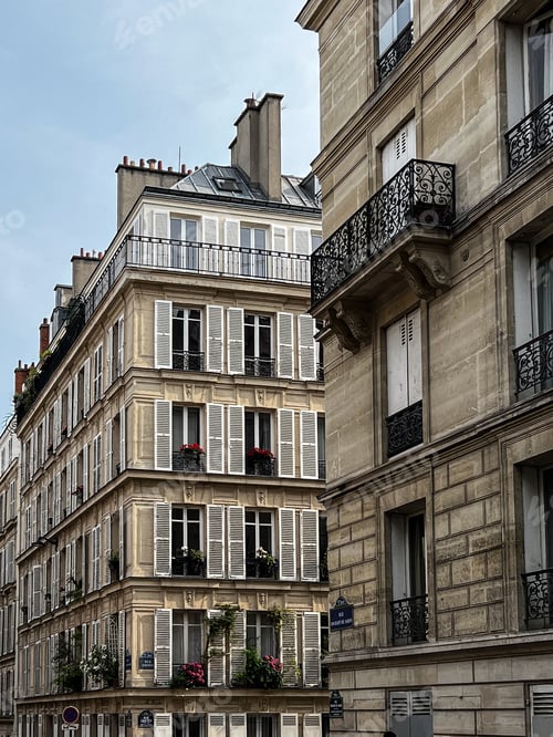 Preview: Facades of houses in Paris with balconies and shutters