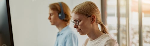 Preview: Focused university student using computer studying in computer room