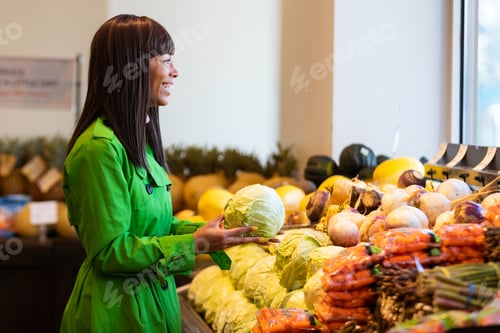 Preview: African American woman shopping for produce in grocery store