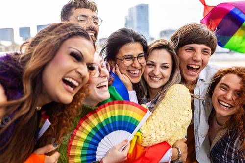 Preview: Young diverse people celebrating gay pride festival outdoors.