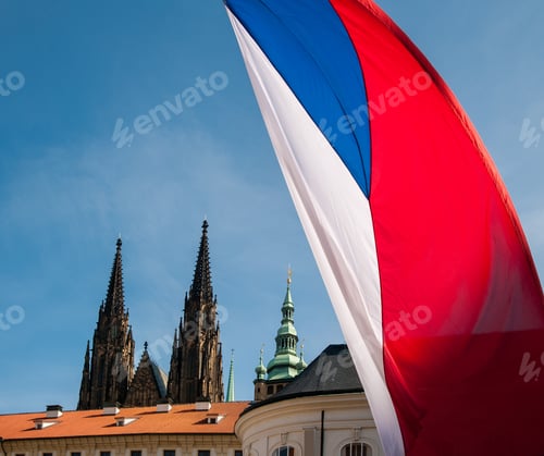 Preview: The flag of the Czech Republic against the the sky, roofs and towers of the cathedral