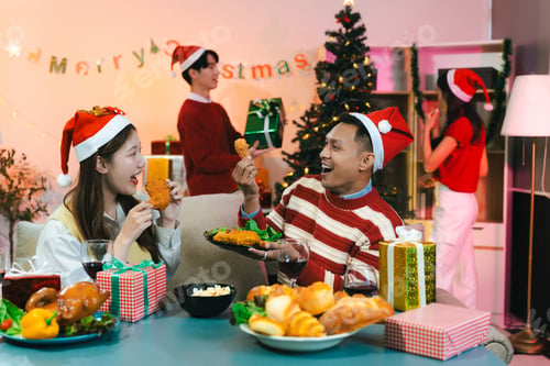 Preview: Dinner and group of people celebrating together at Merry Christmas.