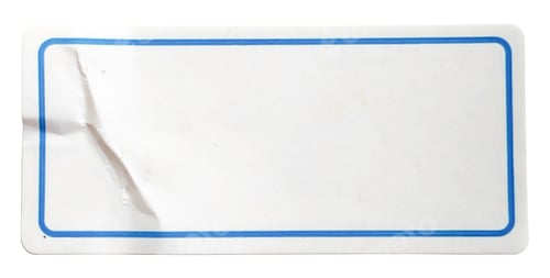 Preview: Blank rectangular white label sticker with a crease and isolated on a white background
