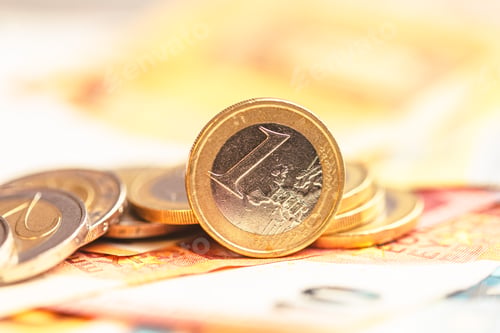 Preview: Euro coins on paper euro banknotes