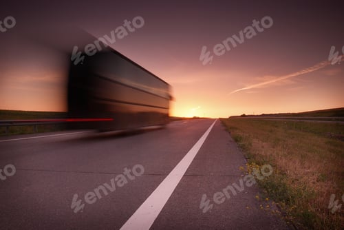 Preview: blurred bus at high speed on the highway at sunset