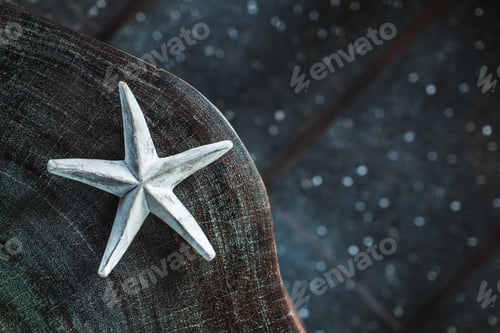Preview: Dark background with one white handmade star, empty place and copy space.