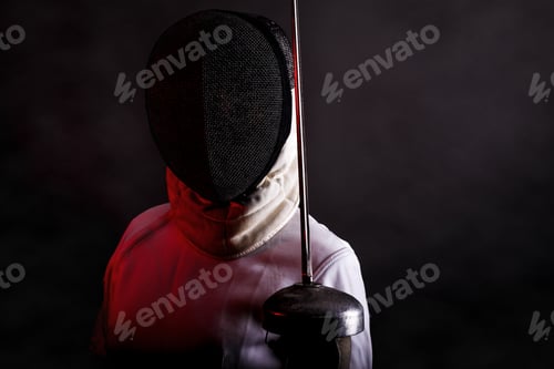 Preview: Portrait of woman wearing white fencing costume practicing with the sword.