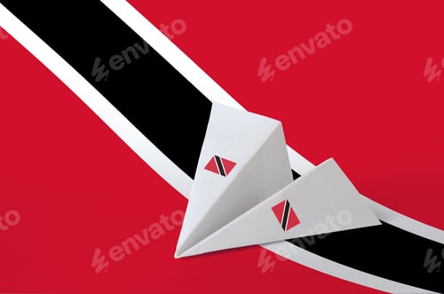 Preview: Trinidad and Tobago flag depicted on paper origami airplane. Oriental handmade arts concept