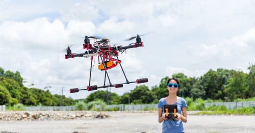 Preview: Young Woman fly with drone