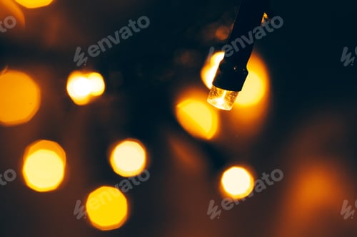 Preview: Bokeh light of holiday garland close up