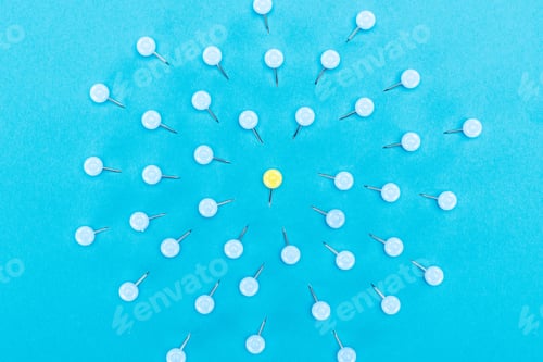 Preview: top view of blue paper clips with one yellow in middle isolated on blue, violence concept