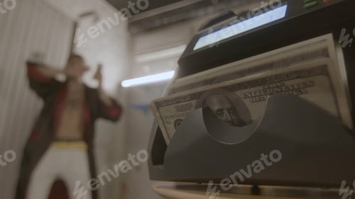 Preview: Machine that counts money and happy man. Footage. Rich man enjoys money. Man has received lot of