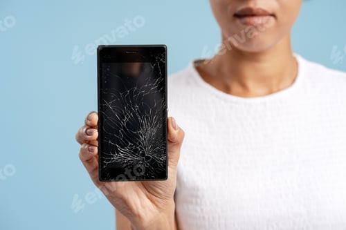 Preview: Woman holding broken smartphone with cracked screen needing repair