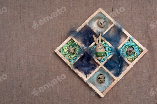 Preview: Banner with the box of natural quail eggs on nests and feathers flatlay