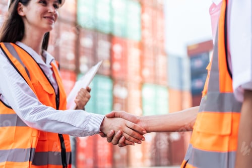 Preview: Close up of business woman and man worker work in container terminal.