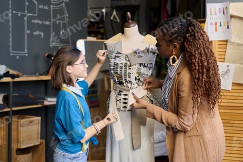 Preview: Female Tailor Teaching Girl with Disability in Atelier