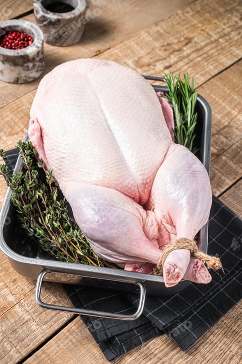 Preview: Cooking Christmas Raw whole duck with herbs and spices. Wooden background. Top view