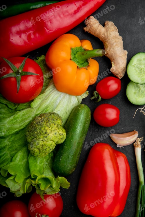 Preview: top view of vegetables as broccoli, pepper, tomato, ginger and others on black background