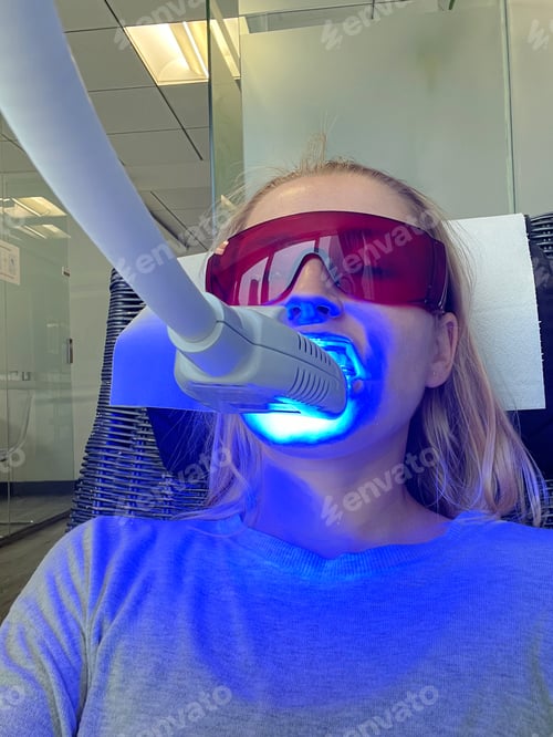 Preview: Woman getting her teeth whitened at the dental clinic
