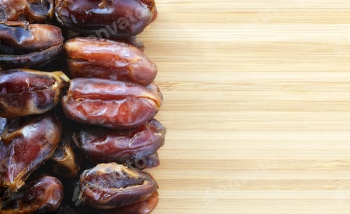 Preview: dried dates on a wooden background