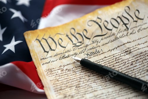 Preview: Preamble to the Constitution of the United States and American Flag close up
