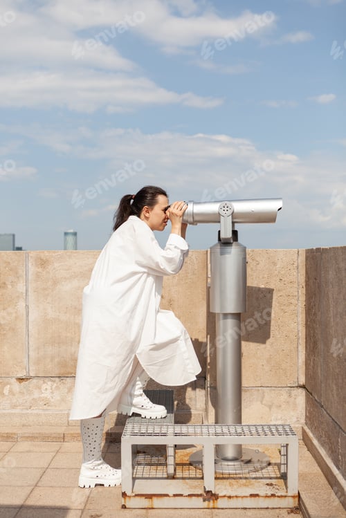 Preview: Toursit caucasian female standing on building tower