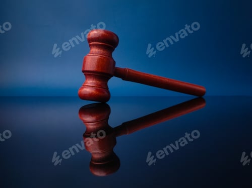 Preview: Wooden gavel with reflection on a black acrylic board