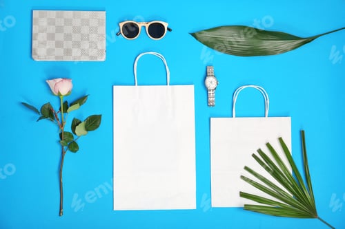 Preview: Stylish flat lay composition with shopping bags on color background