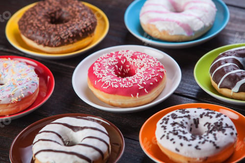 Preview: Donuts on wooden table.