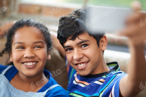 Preview: Smile sis. Cropped shot of a little brother and sister taking a selfie.