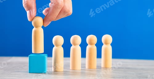 Preview: successful team leader, businessman hand choose people standing out from the crown.