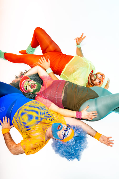 Preview: Carefree drag queens lying on floor with V sign
