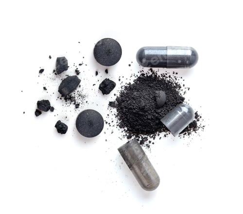 Preview: Activated charcoal capsule and Tablets isolated on white. top view