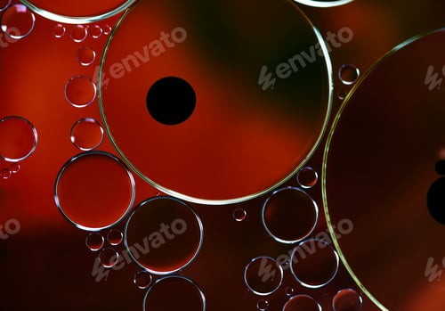 Preview: The circle shape of the oil droplets on red water