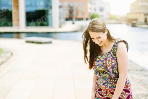 Preview: Woman standing by canal