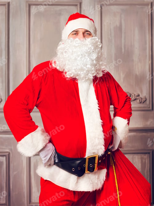Preview: Photo of happy Santa Claus with big bag of presents