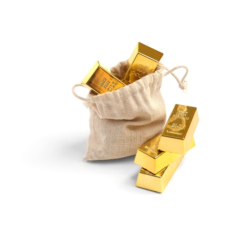 Preview: Gold in a canvas bag on white background