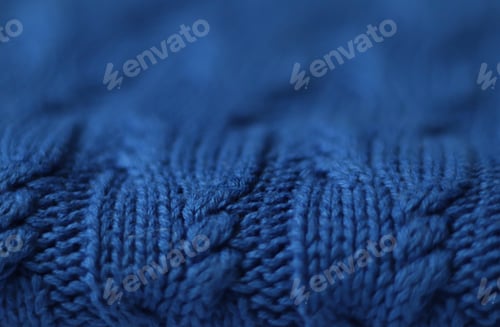 Preview: Seamless knitted fabric with pigtails. Knitted sweater, plaid. Knitted background.